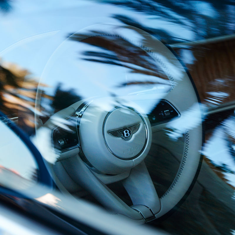 Bentley Residences Dezervator patented car elevator system transporting a Bentley automobile to a private sky garage